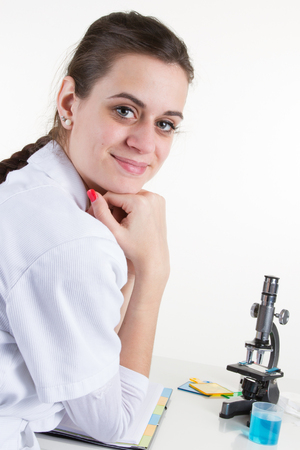 Female scientist with a microscope in laboratoryの写真素材