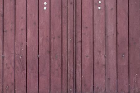 The old red wood texture with natural patternsの写真素材