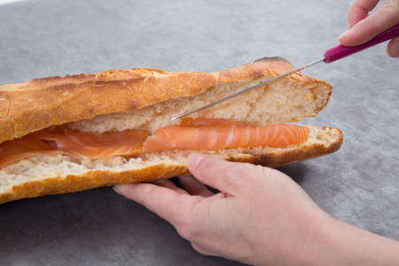 Handmade bread with salmon. Detail of sandwiches on plate.の写真素材
