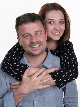 Closeup portrait of  beautiful happy couple isolated on white background. Attractive man and woman being playful.の写真素材