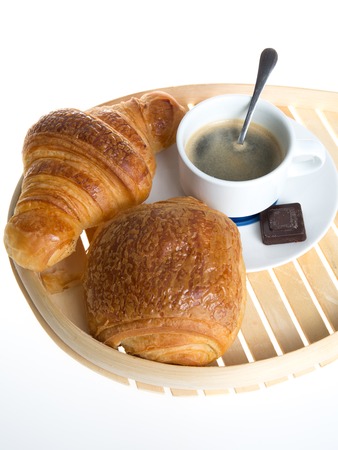 Cup of coffee with french croissant and chocolatine with chocolateの写真素材