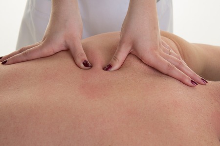 Close-up of a man's back having a massage in a spa centerの写真素材