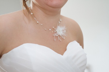 Young bride in wedding dress with necklace on her wedding dayの写真素材