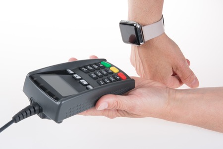 Woman using her smart watch to pay