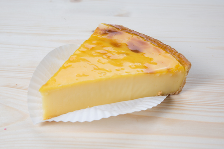Tasty Flan at home, under a wooden tableの写真素材
