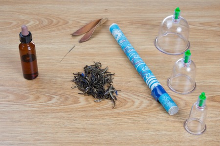Acupuncture needles, moxa sticks, macerated oil, herbs TCM Traditional Chinese Medicine concept...