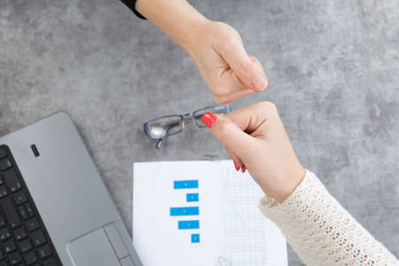 Two Businesspeople shaking hands indoorsの写真素材