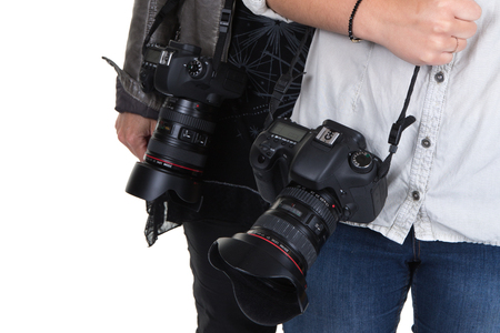 Cropped image of two women holding camera in studioの写真素材