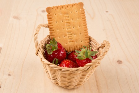 strawberries in natural background with cake for tea timeの写真素材