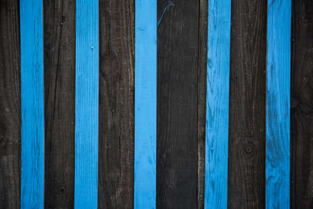 Blue and black wooden wall, striped background of wooden plankの写真素材
