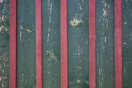Pink and green wooden wall, striped background of wooden plankの写真素材