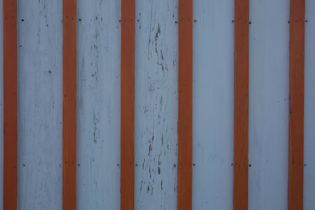 aged pannel blue wood background with red stripesの写真素材
