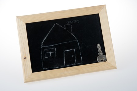 sketch of house and key on the blackboardの写真素材