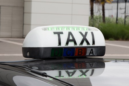 Taxi sign on the carの写真素材