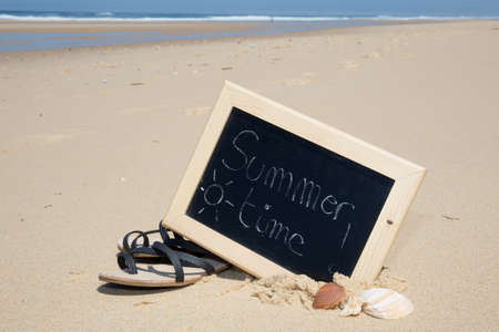 Summer Time written with chalk on a blackboardの写真素材