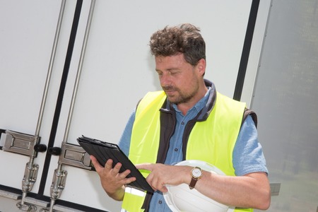 Delivery: Man Checking Portable Delivery Device