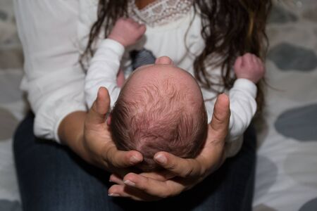 mother holding babyの写真素材