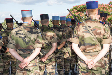 Military men at a parad under blue sky