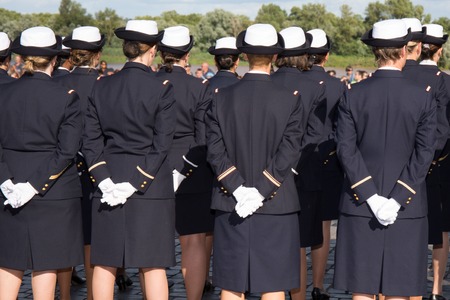 Military girls cadets in uniform marching in parade