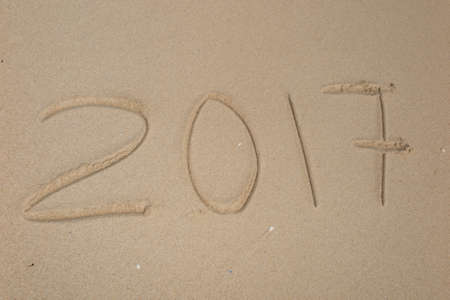 2017 inscription written on sandy beachの写真素材