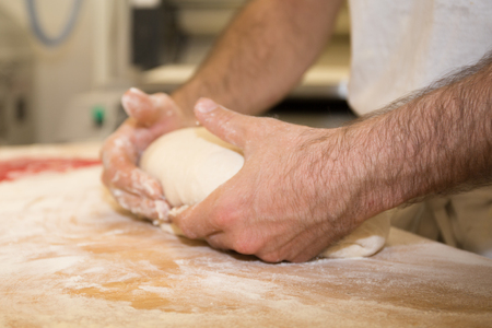 Making of bakery products in bakery shop by a chief baker