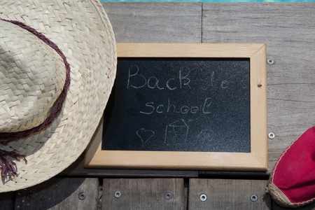 Back to school blackboard / chalkboard. on the wooden deckの写真素材