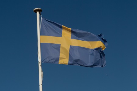 Flag of the Sweden against blue skyの写真素材