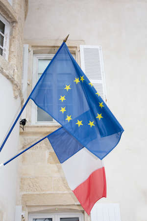 Flags of the European Union and France in clear windy dayの写真素材