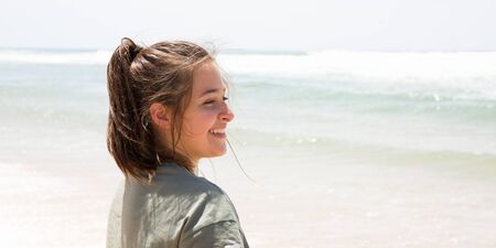 teenager girl on beach in summer dayの写真素材