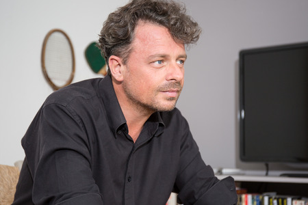 Portrait of thoughtful young handsome man looking awayの写真素材