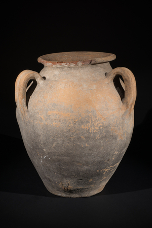 An old pot or historic antique vase on black backgroundの写真素材