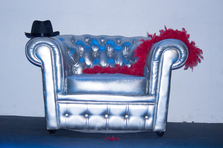 Gray armchair Chesterfield posed alone with disguises on festive symbol finishedの写真素材