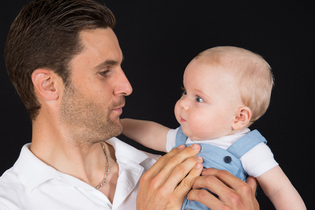 Father Hugging Newborn Babyの写真素材