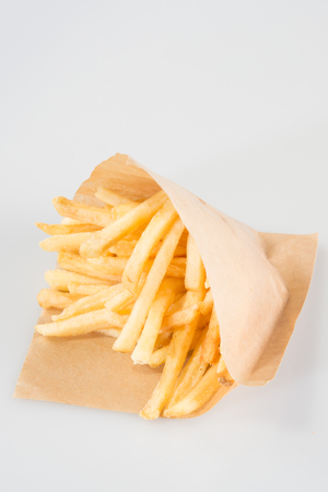 French fries in paper box, isolated on white
