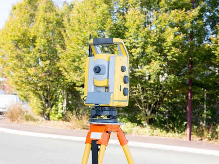 Surveyor equipment telescope at construction site, Surveying for making contour plans are a...