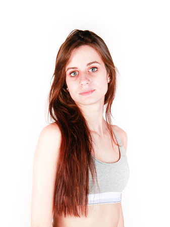 A beautiful young slim girl in sportswear with long hairの写真素材