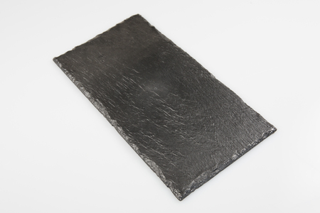 black slate signboard isolated on white backgroundの写真素材
