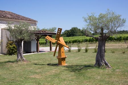small wooden mill in the garden with olive trees Olivierの写真素材