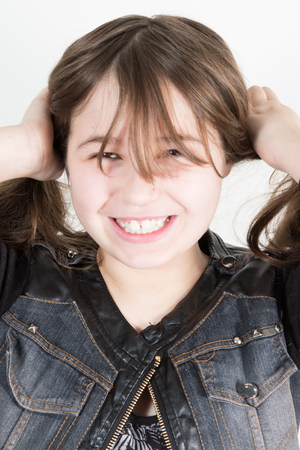 Close up shot of beautiful Caucasian little girl play and funの写真素材