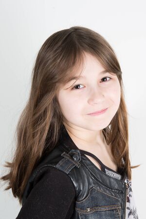 Young casual style child girl portrait isolated over white backgroundの写真素材