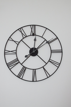 big and old clock with Roman numerals