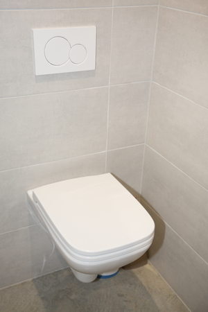 suspended toilet white in wc after restorationの写真素材