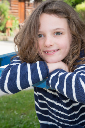 brunette cheerful kid girl child outdoorの写真素材