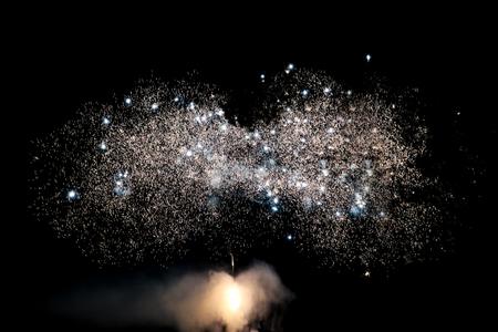 Fireworks display on dark sky backgroundの写真素材