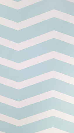 Beautiful white wall in the form of blue geometric wavesの写真素材