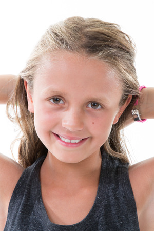 beauty portrait child girl hands on hairsの写真素材