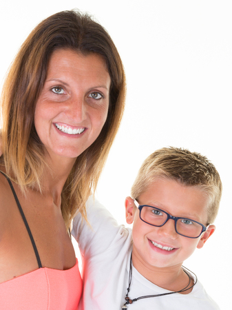 Happy beauty mother and son with glasses isolated on white backgroundの写真素材