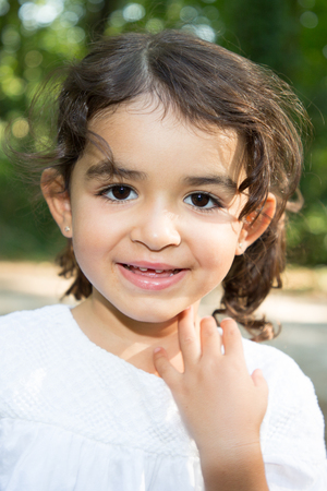 portrait cheerful child girl brunette happy outdoorsの写真素材
