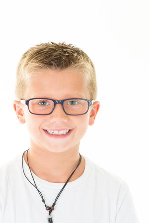 Little boy blond with glasses portrait wear white shirtの写真素材