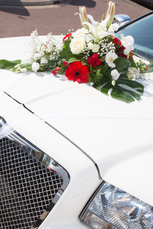 white limo car with flowers bouquet for wedding celebrationの写真素材